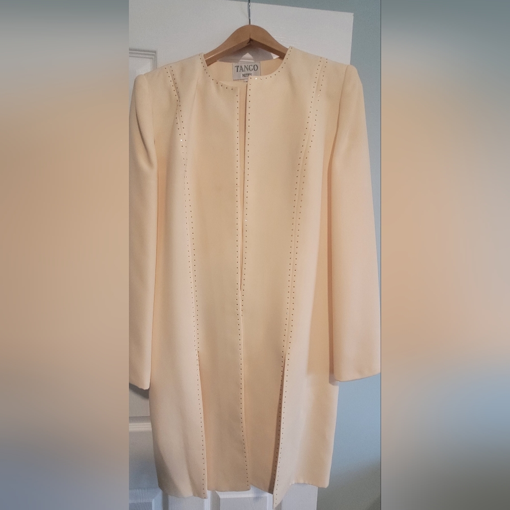 Three piece skirt suit.